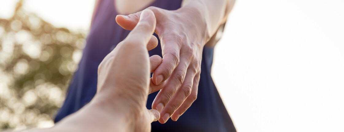 Female hands reaching out for help each other.